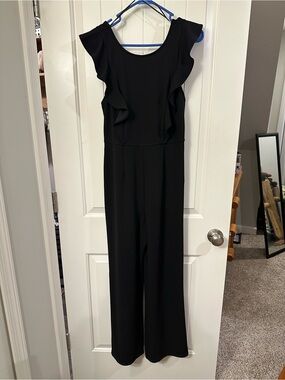 Francesca's Collections Black Ruffle-Shoulder Jumpsuit